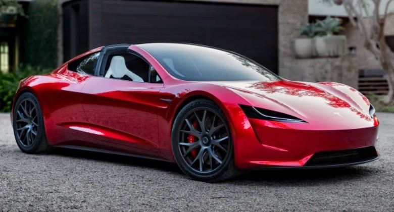 Foto Tesla Roadster vermelho estacionado